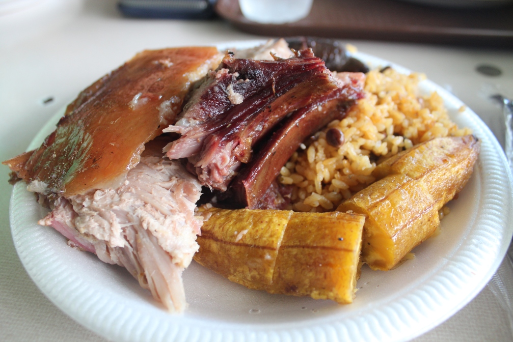 Lechon (roasted pig), plantain, rice and pigeon peas, blood sausage, Guavate, Cayey, Puerto Rico